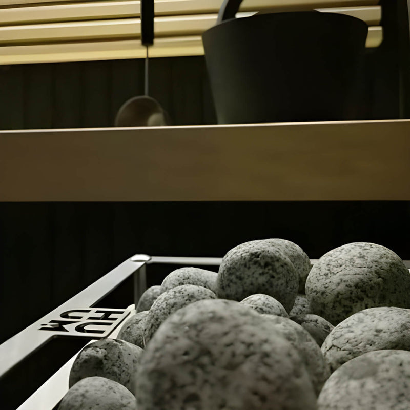 Close-up of decorative sauna heater stones with a blurred background