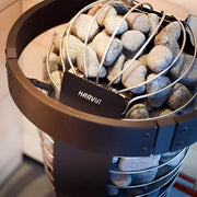 sauna heater with protective flange and rocks