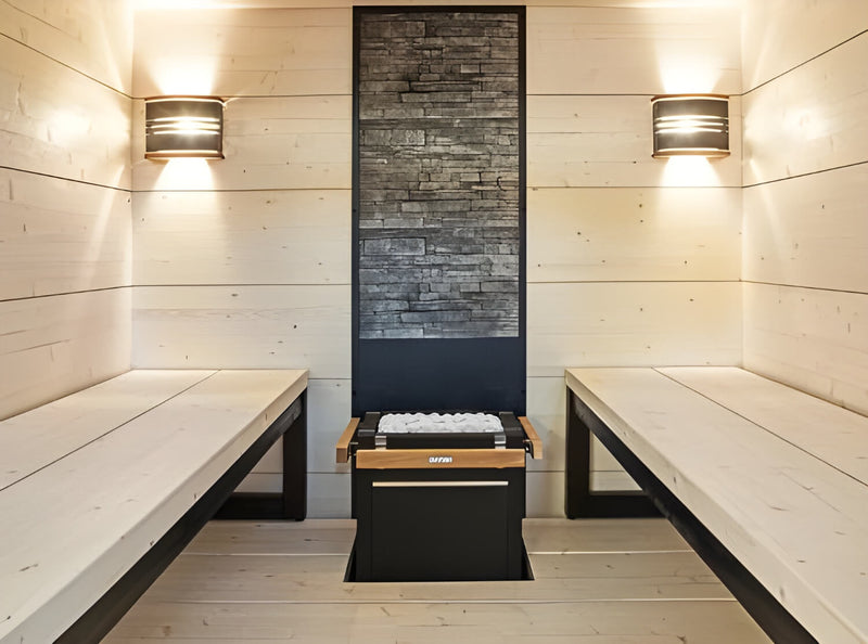 Wooden sauna interior with benches and a central heating unit.