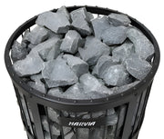 Harvia sauna heater with sauna stones and visible brand logo on a white background