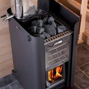 Black sauna heater with visible flames and rocks inside, set against a wooden interior background.