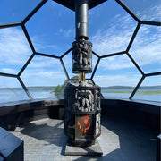 Geodesic dome with a wood-burning sauna heater and view of water and sky