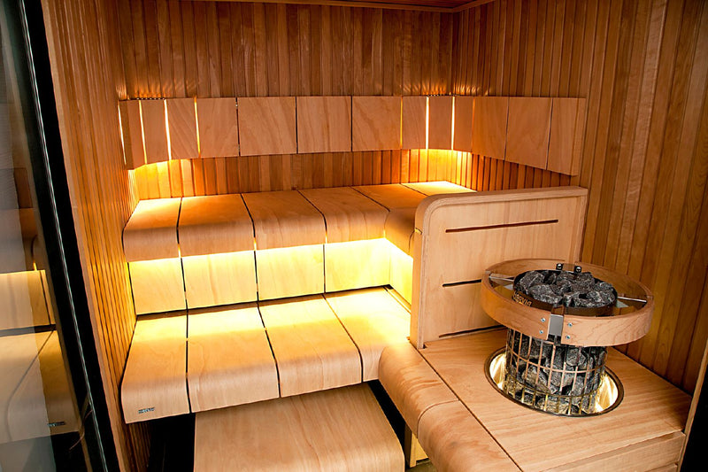 Wooden sauna interior with bench and sauna heater
