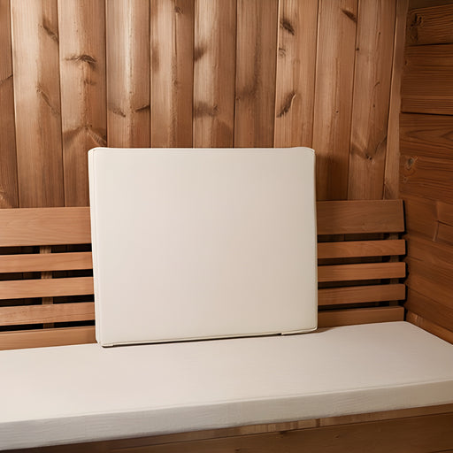 White cushion on a wooden bench with wooden wall background