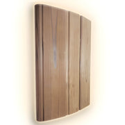 Wooden wall-mounted light fixture with a warm glow on a white background