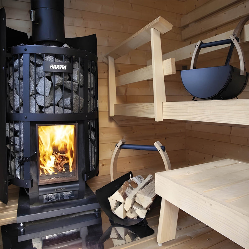 Wood-burning sauna heater in a wooden sauna with a bench and firewood.
