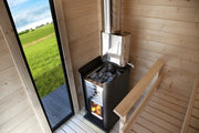 Wood-burning sauna with visible fire and Harvia branding on a white 