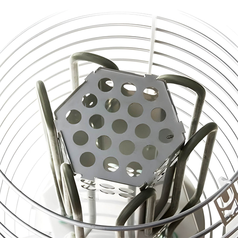 Metal grater with a perforated design on a white background